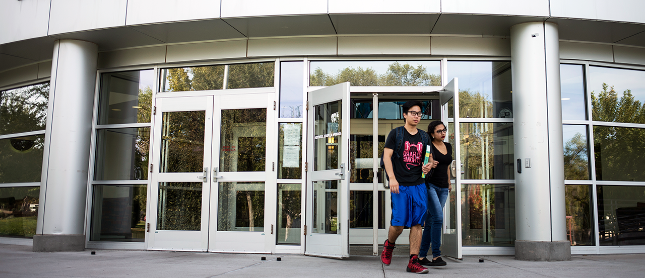 Hero image of students walking out of the Fidel Student Center